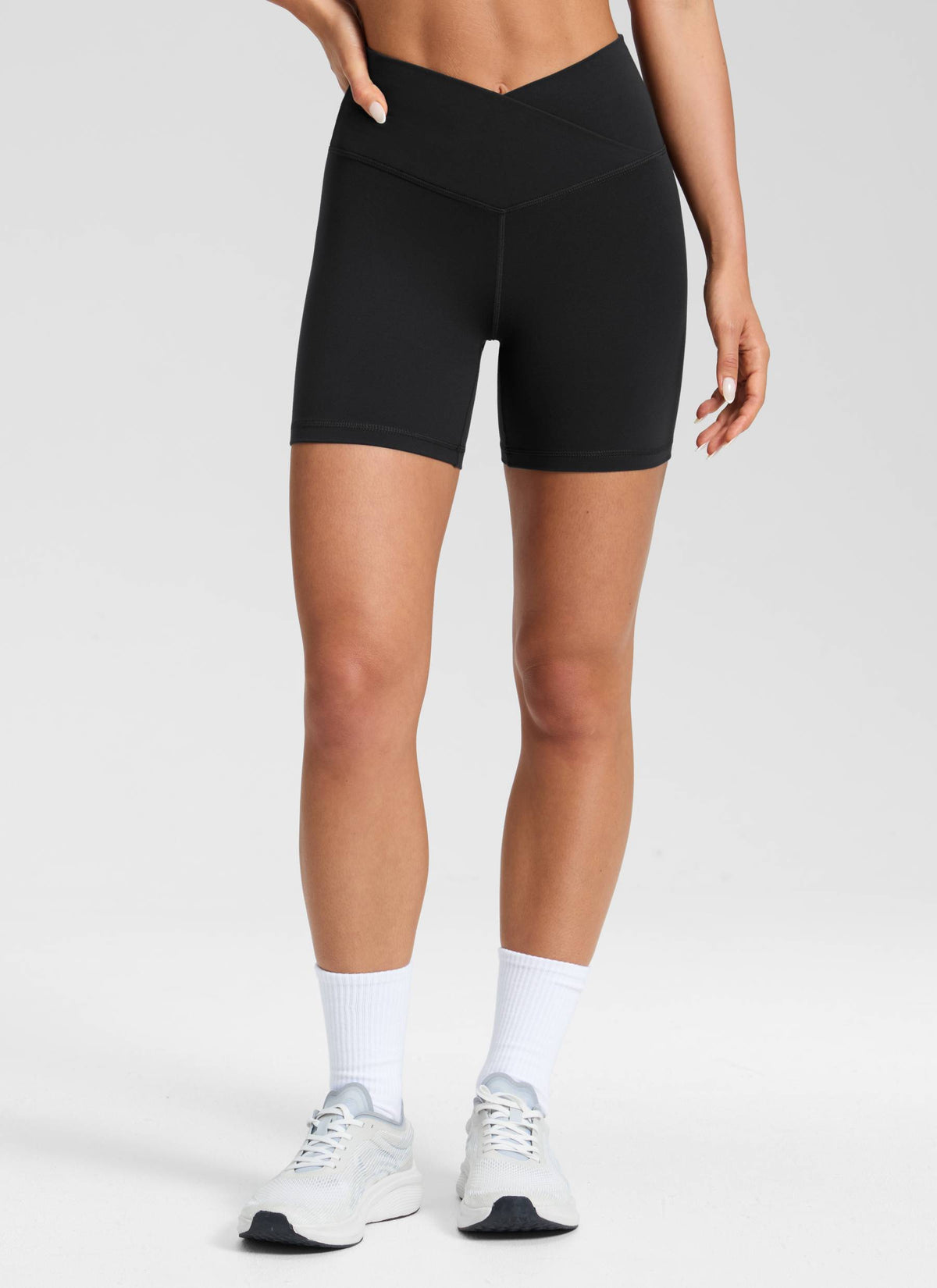 CRZ YOGA Women's High Rise Butterluxe V Cross Waist Biker Shorts 5'' Black @model_info:Isidora