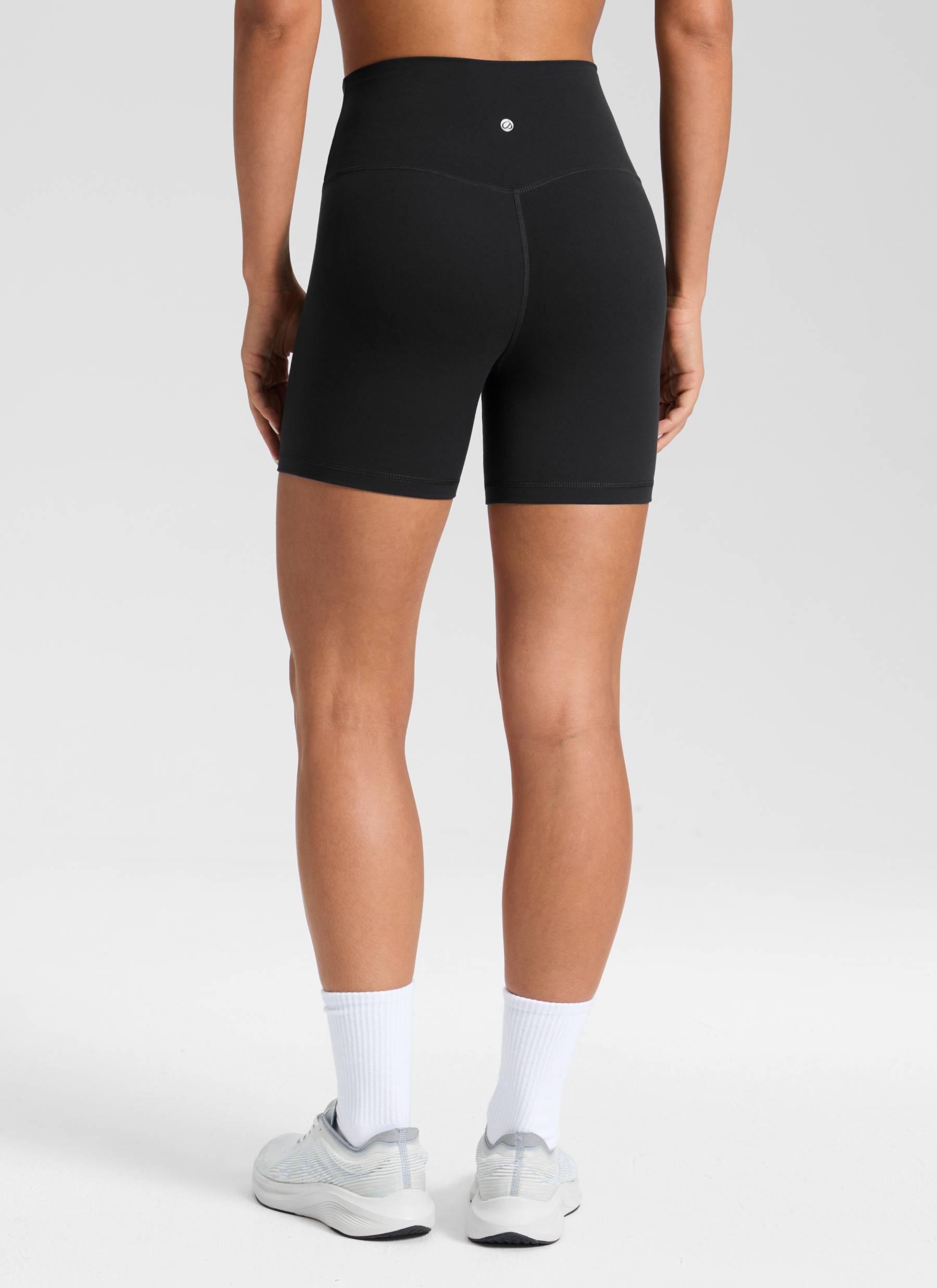 CRZ YOGA Women's High Rise Butterluxe V Cross Waist Biker Shorts 5'' Black @model_info:Isidora